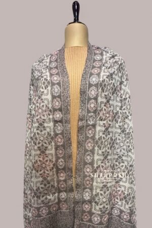 Stole with a geometric and floral pattern in greyish, white, and soft pastel tones.