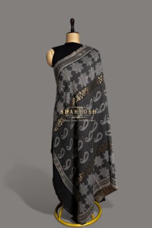 Elegant black Jamawar Pashmina shawl with silver and gold patterns. Luxurious, warm, and perfect for any occasion.