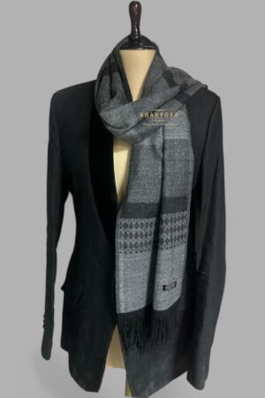 A stylish black and gray patterned muffler exuding sophistication and warmth.