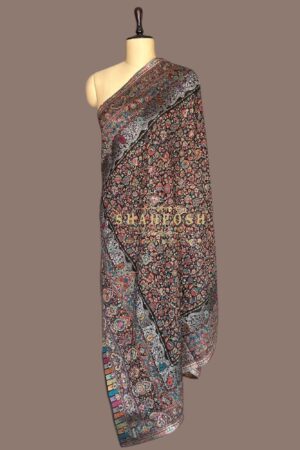 A kalamkari Shahposh Shawl where a deep, nocturnal canvas blossoms with a symphony of  florals.