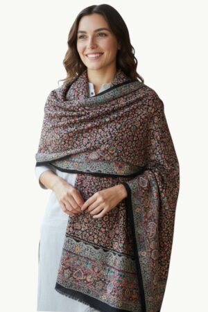 A kalamkari Black Shahposh Shawl where a deep, nocturnal canvas blossoms with a symphony of  florals.